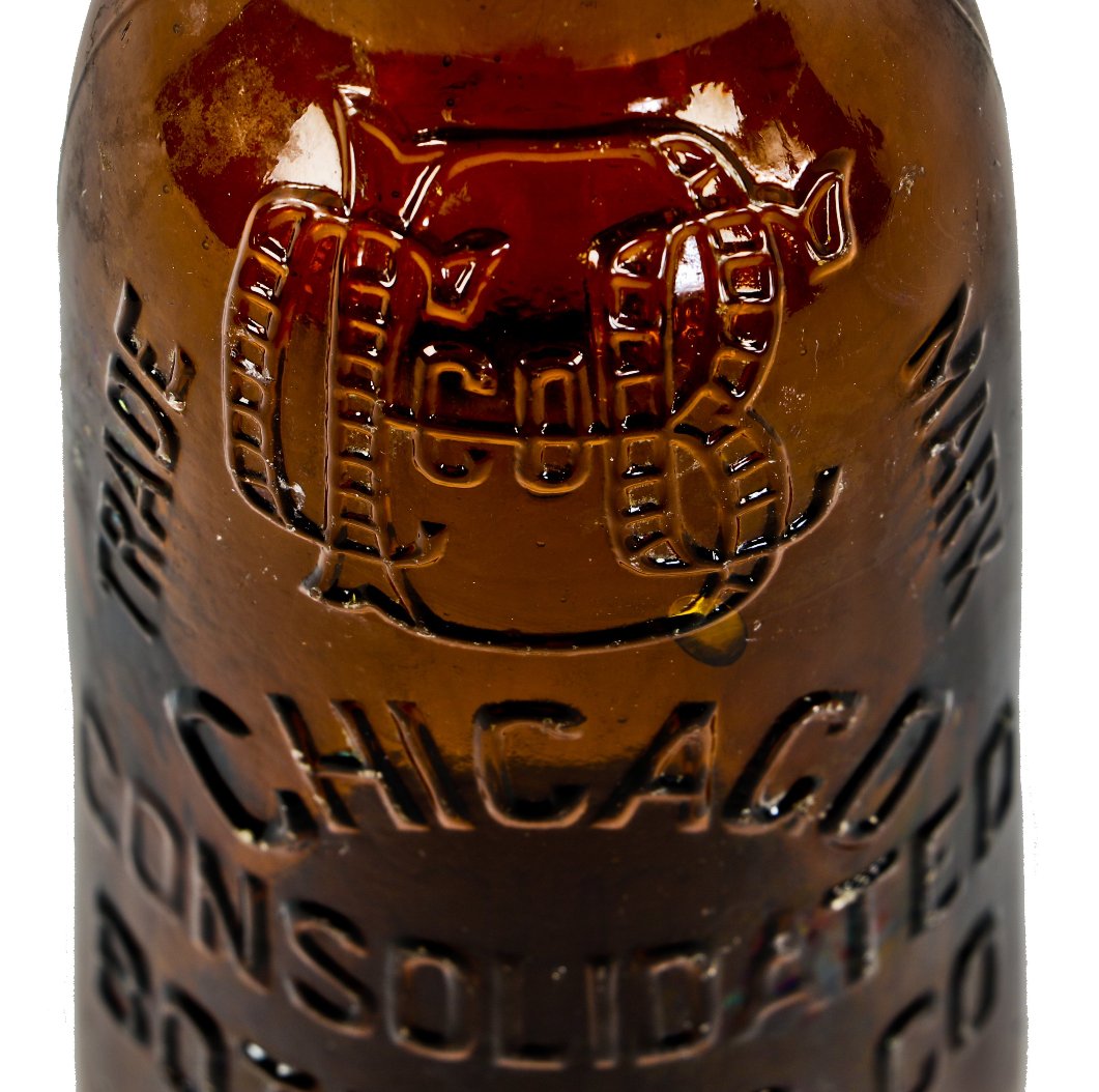 rare and unusual privy dug late nineteenth century amber blobtop soda or mineral water bottle manufactured by the lomax bottling operations' late iteration as the consolidated bottling company
