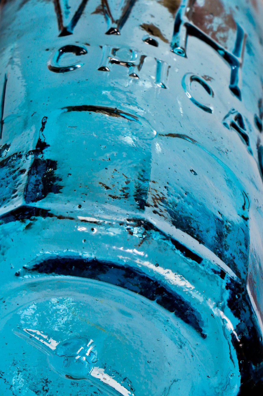 original and intact 1860's-1870's cobalt blue blobtop gravitating soda bottle with mug base manufactured for chicago bottler william henry hutchinson.