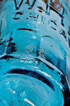large lot of nearly 20 similar c. 1860's-1870's original chicago privy-dug william h. hutchinson cobalt and aqua blue paneled or "mug base" soda or mineral water bottles