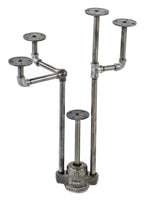 repurposed vintage american industrial object display stand with weighted boylston cast iron grease trap valve cover and old crane plumbing pipe fittings