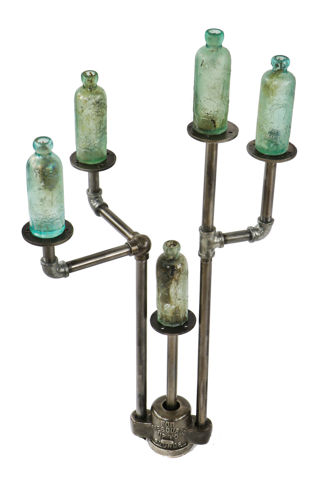 repurposed vintage american industrial object display stand with weighted boylston cast iron grease trap valve cover and old crane plumbing pipe fittings