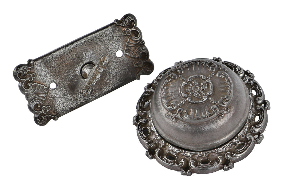original early 20th century antique american late victorian era ornamental cast iron flush mount exterior residential doorbell with matching thumb turn with escutcheon