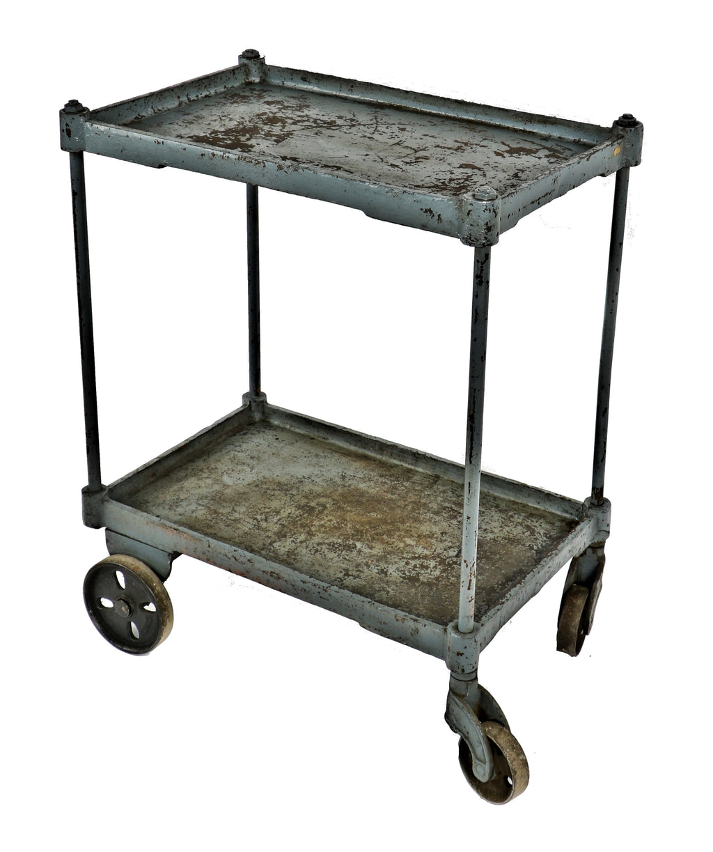 heavily reinforced early 20th century american industrial cast iron and steel mobile two-tier factory cart with original and fully functional stationary and swivel casters