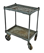 heavily reinforced early 20th century american industrial cast iron and steel mobile two-tier factory cart with original and fully functional stationary and swivel casters
