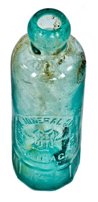 original and intact turn of the century dug deep blue aqua hutchinson bottle with mug base manufactured for the bristol mineral spring company.