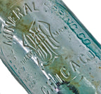 original and intact turn of the century dug deep blue aqua hutchinson bottle with mug base manufactured for the bristol mineral spring company.