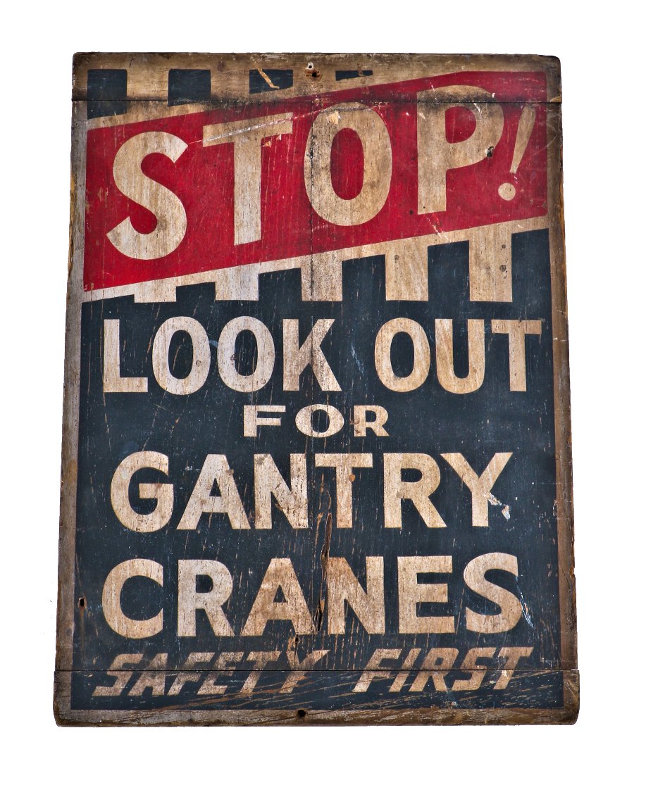 remarkable all original early 20th century antique american industrial folk art gantry crane "safety first" painted wood double-sided sign with allover crazed finish