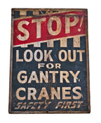 remarkable all original early 20th century antique american industrial folk art gantry crane "safety first" painted wood double-sided sign with allover crazed finish