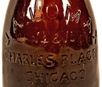 all original and hard to find antique late nineteenth century deep amber glass quart size bottle manufactured for chicago bottling giant john a. lomax