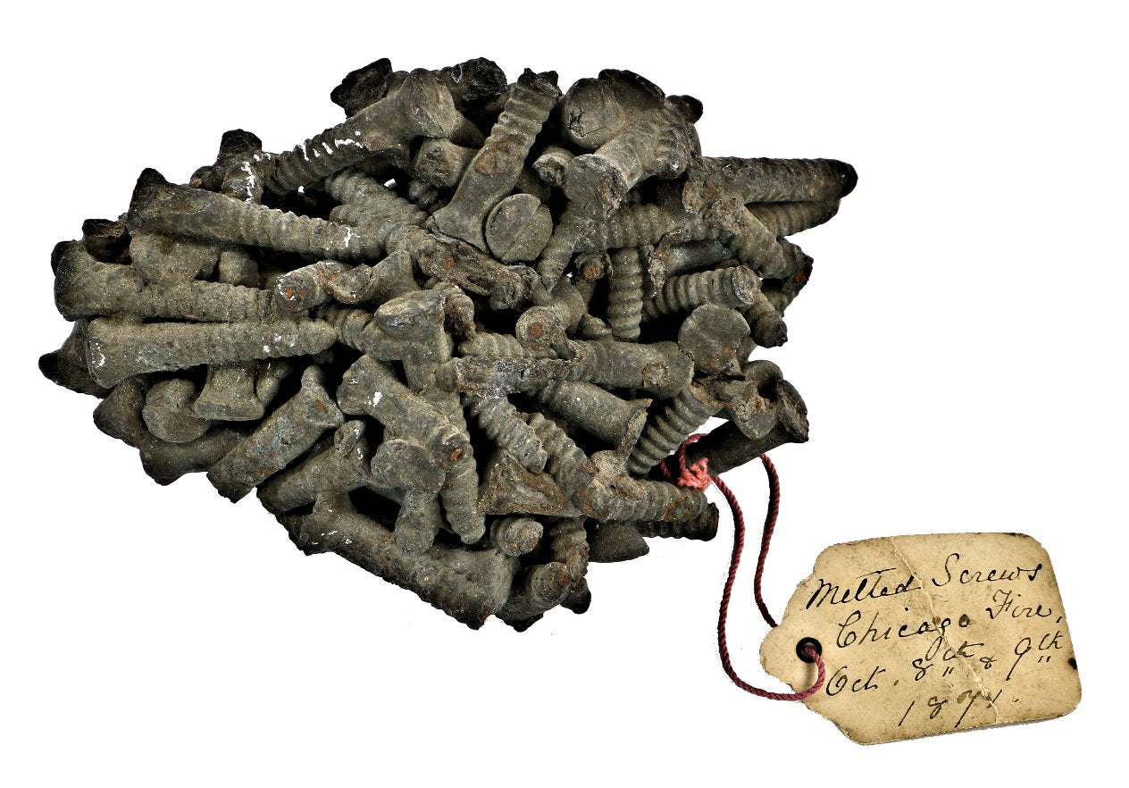 remarkable and historically important all original documented great chicago fire of 1871 "souvenir" or artifact in the form of melted metal screws salvaged from the "burnt district"