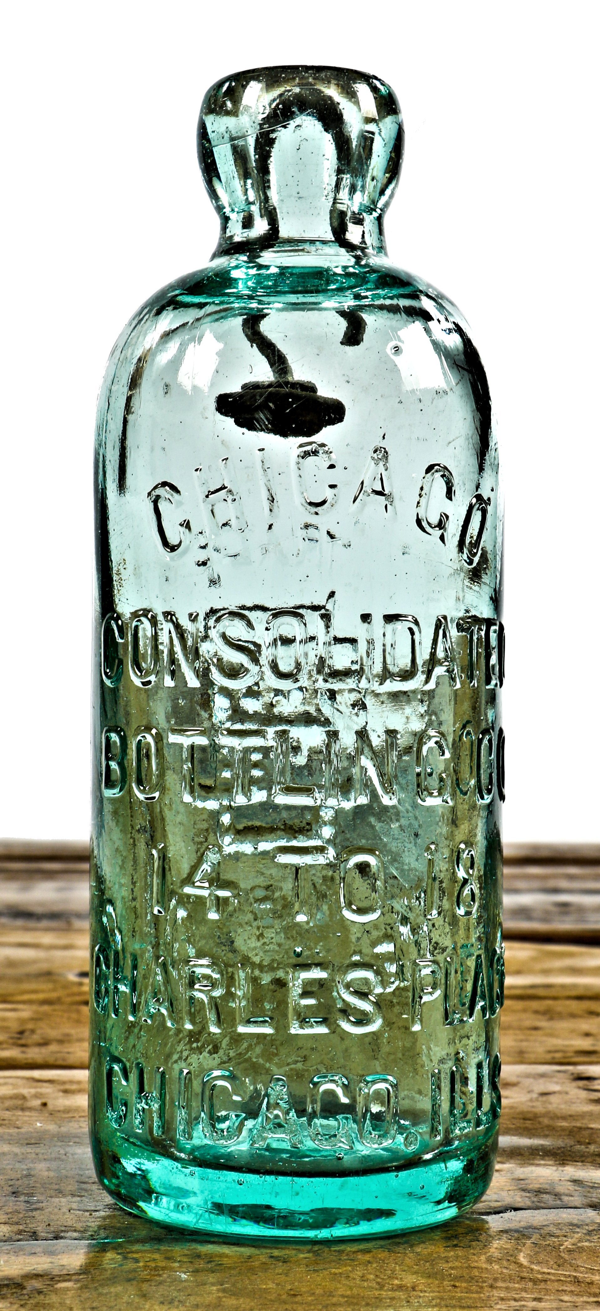 original and completely intact c. 1880's attic mint light aqua hutchinson style blobtop soda bottle manufactured for the consolidated bottling co., in chicago, il.
