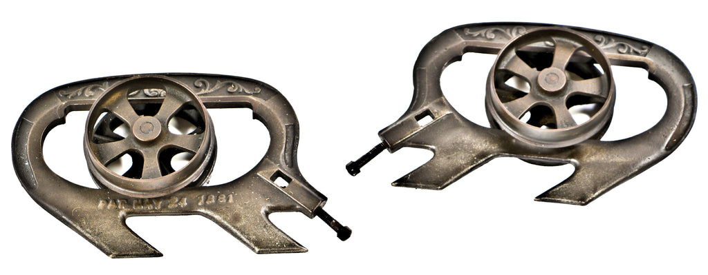 hard to find completely intact and all original early 1880's antique american victorian era interior residential sliding or pocket door hangers with grooved edge spoked wheels