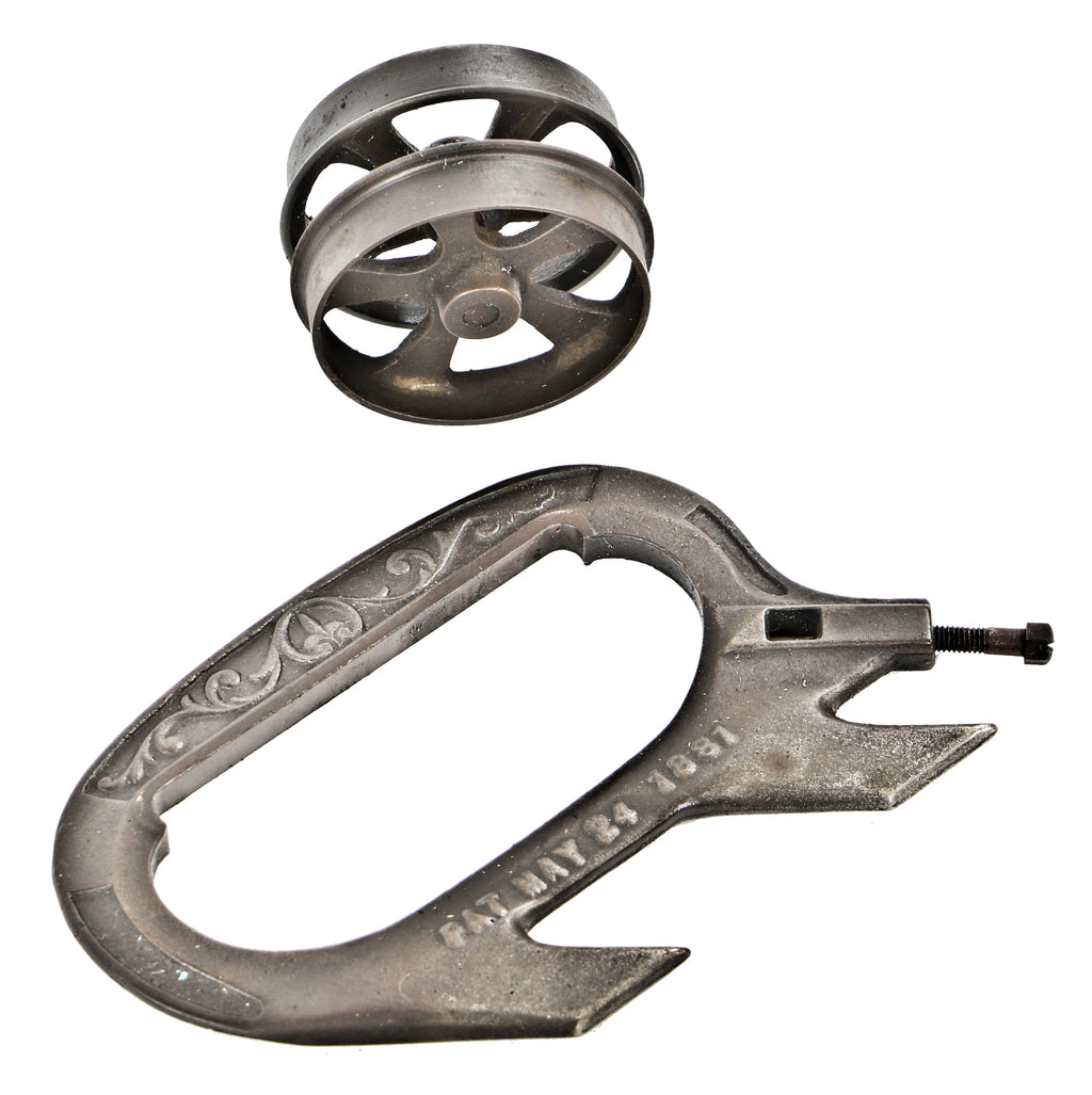 single early 1880's original and fully functional interior residential antique american victorian era ornamental cast iron pocket or sliding door hanger with spoked track wheel