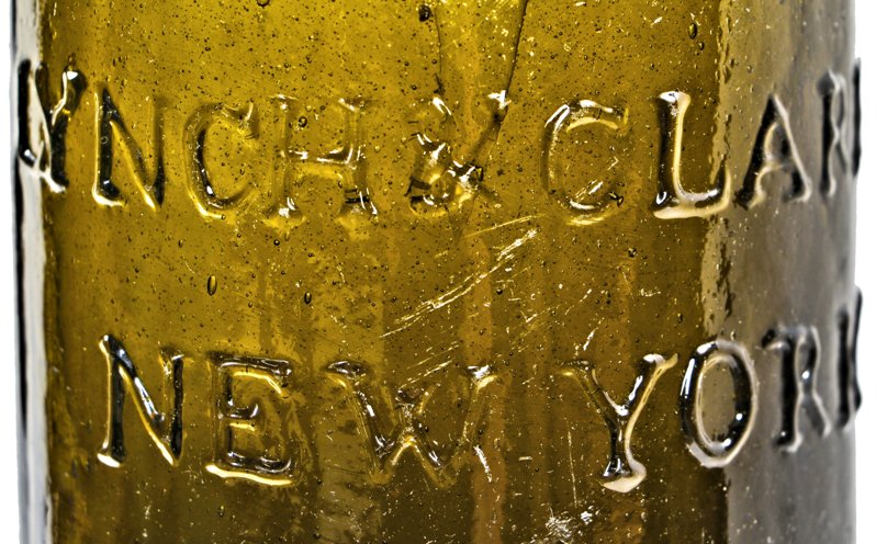 exceptional rare and all original early c.1825-1833 black glass saratoga pint spring water bottle manufactured for thomas lynch and john clarke in new york