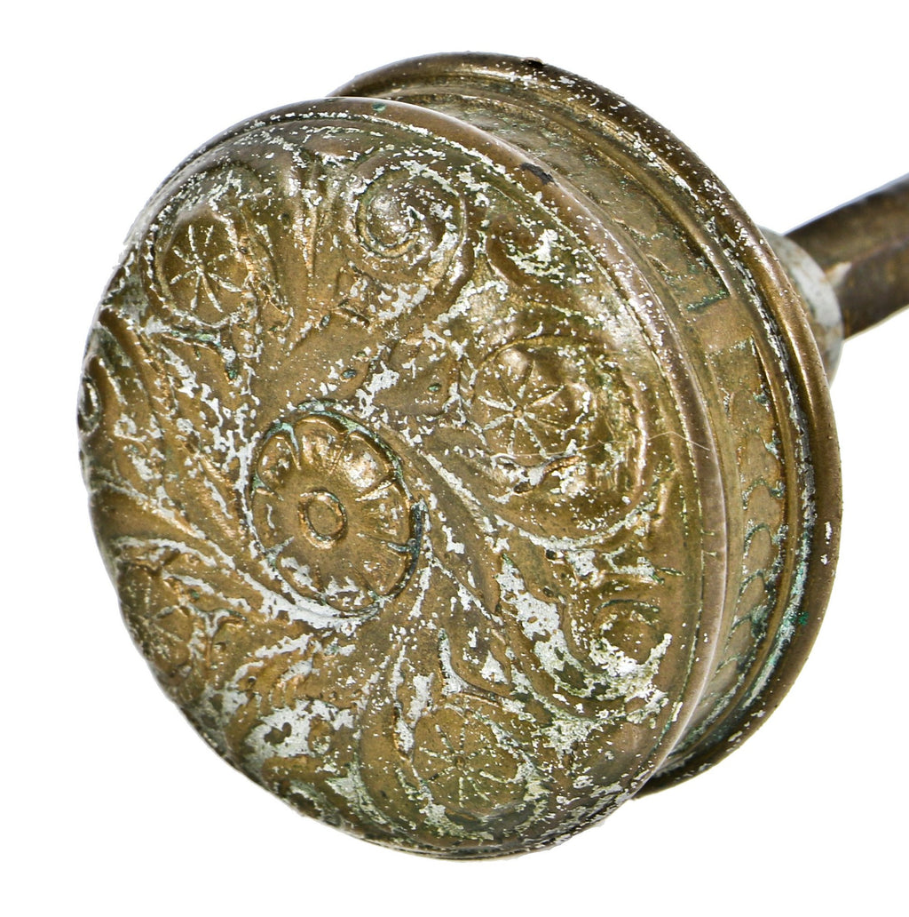 one of two matching original antique american ornamental cast brass "rope" pattern residential entrance door handle with centrally located floral motif
