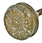 one of two matching original antique american ornamental cast brass "rope" pattern residential entrance door handle with centrally located floral motif