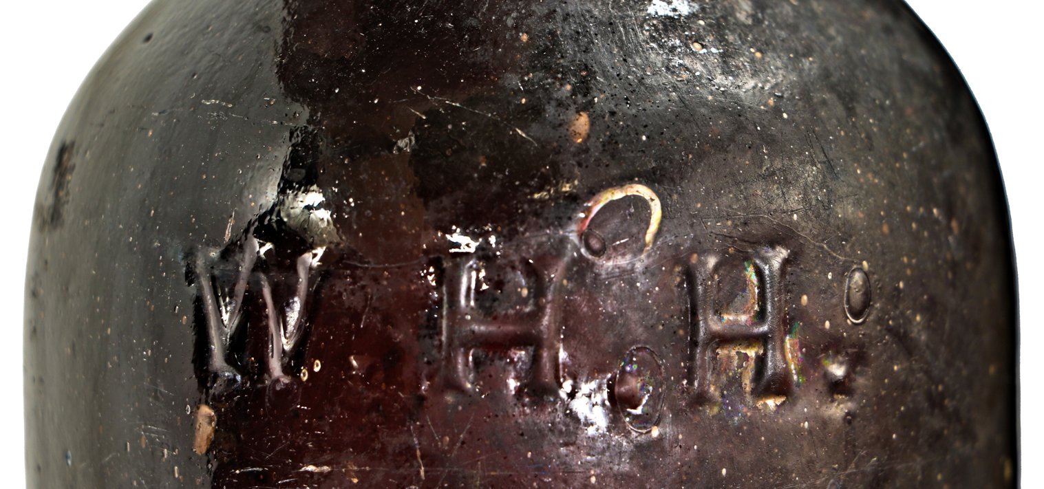 collectible antique c. 1865-1875 privy dug richly colored black glass "w.h.h." quart size glass ale bottle manufactured by william mccully & co., in pittsburgh, pa