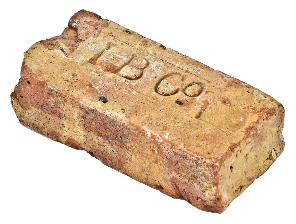 single original and documented 19th century stamped brick architectural artifact salvaged from the charles place lomax bottling works building site