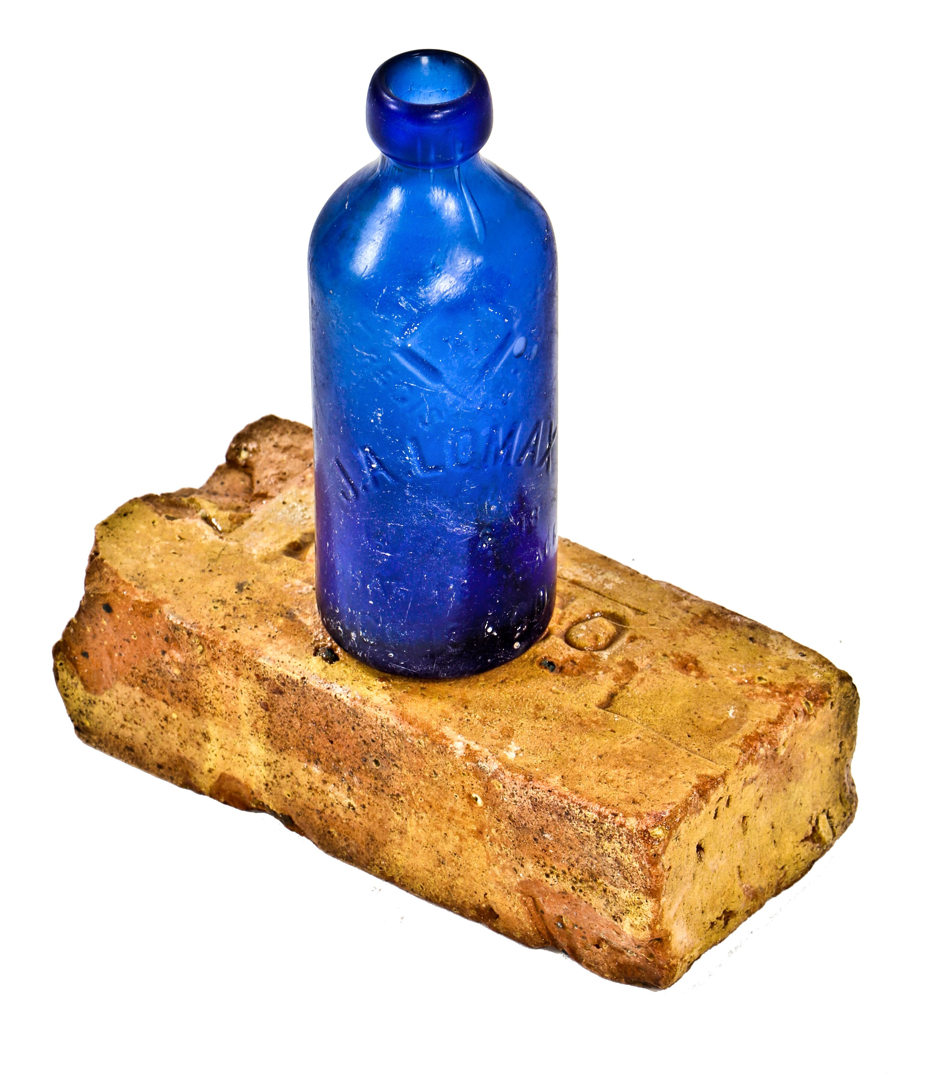 single original and documented 19th century stamped brick architectural artifact salvaged from the charles place lomax bottling works building site