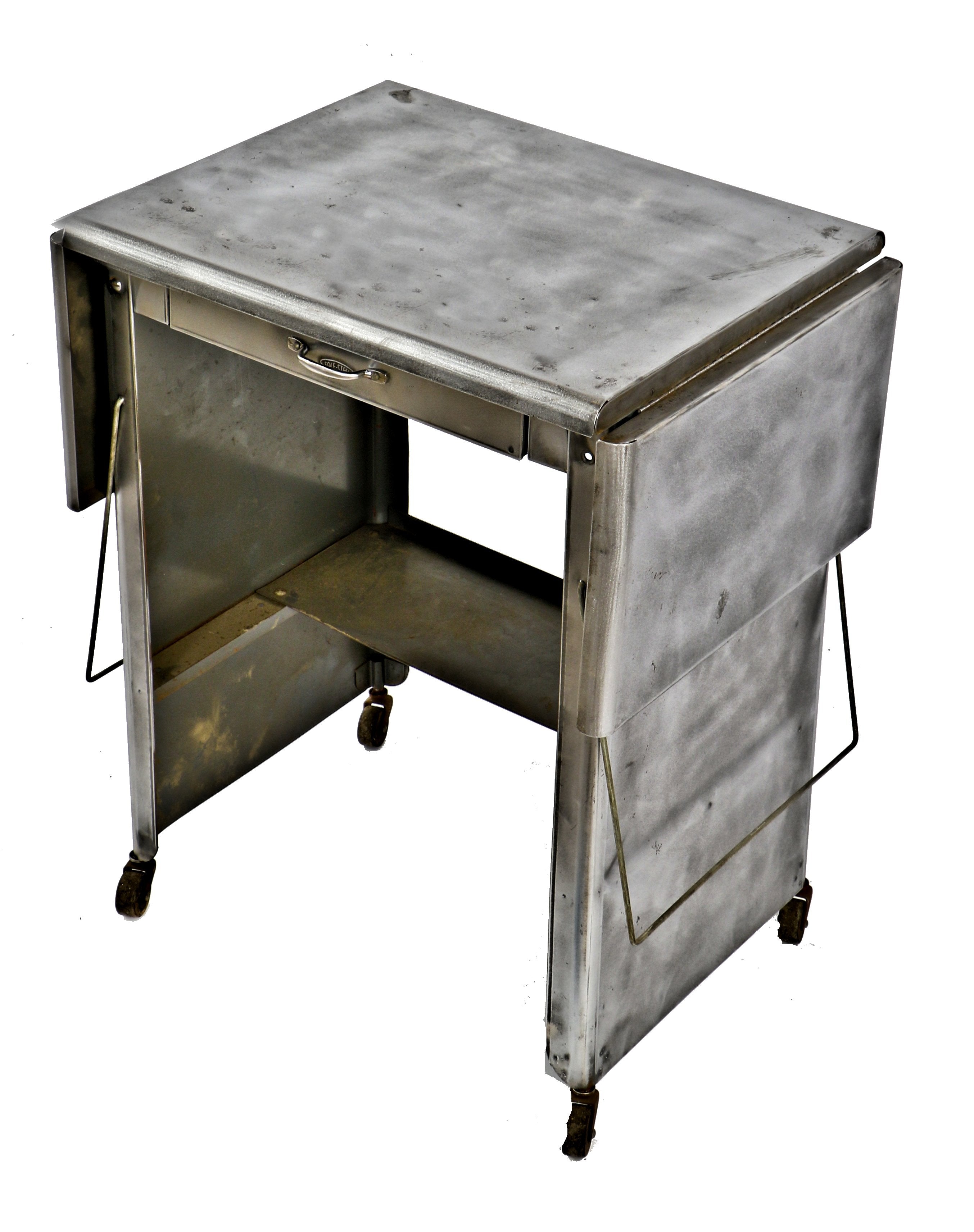 late 1940's or 1950's american industrial cold-rolled steel mobile factory office drop-leaf typewriter desk with single drawer and fully functional swivel casters