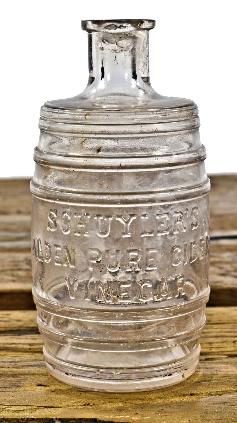 original and hard to find turn of the century clear glass unusual barrel shaped "schuyler's" vinegar bottle dug from a chicago area and fabricated for schuyler & cook of chicago.