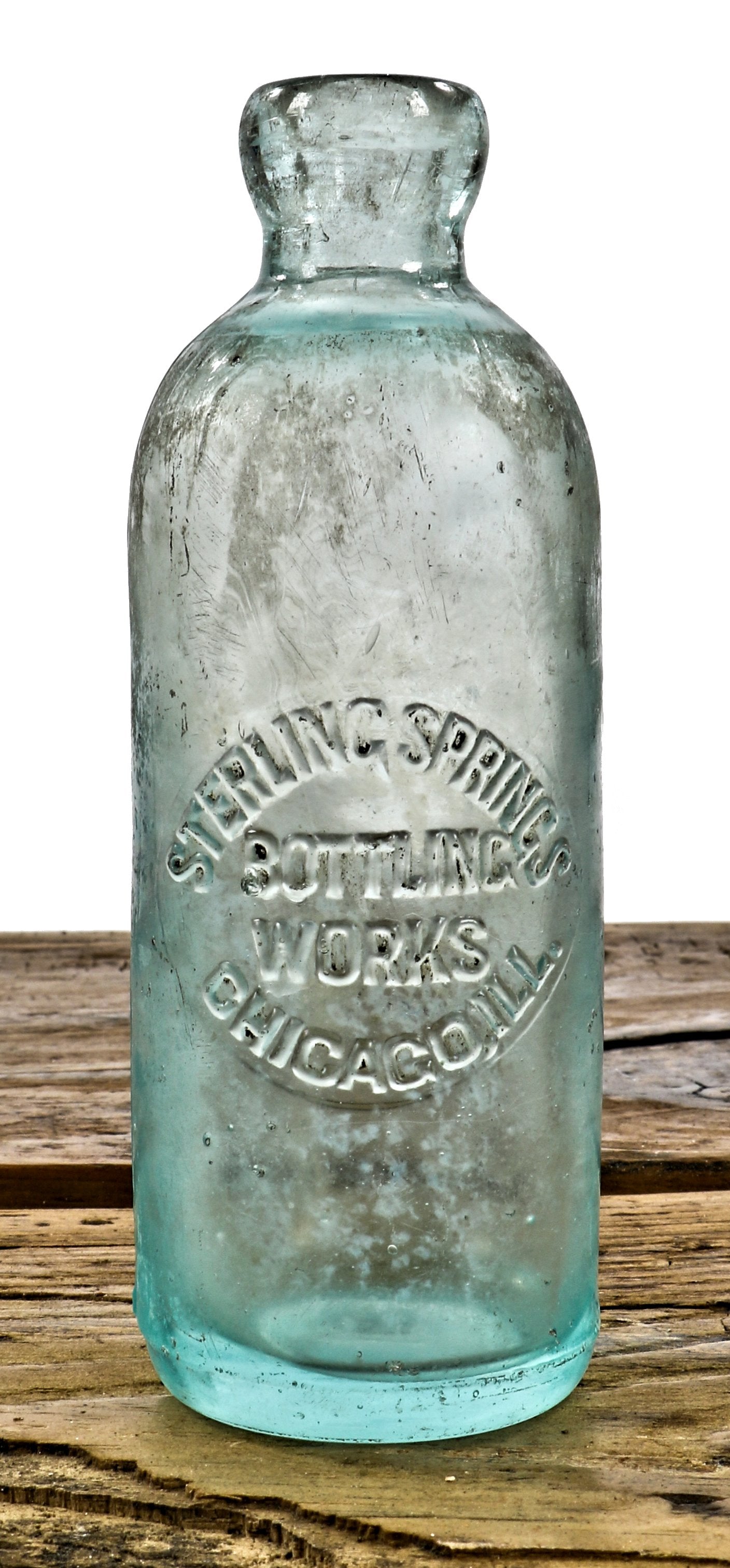 single original turn of the century antique aqua blue tinted glass hutchinson style blobtop bottle fabricated for the chicago based sterling springs bottling works in alton, il.