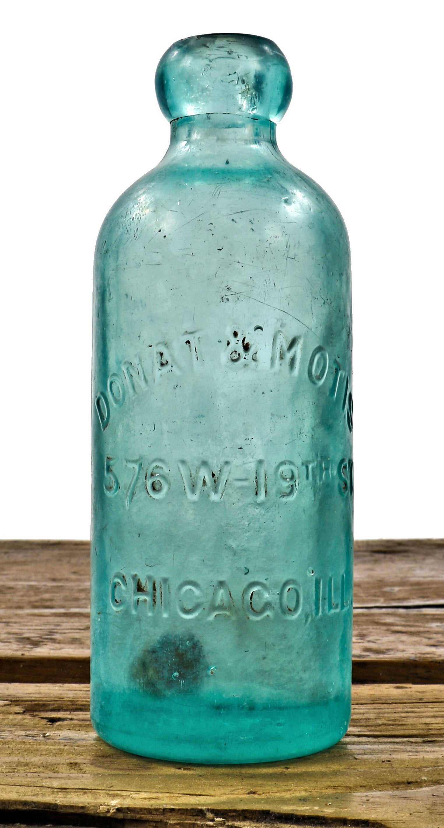 rare original and completely intact c. 1880's blue aqua glass hutchinson style blobtop bottle manufactured for chicago bottlers donat & motis.