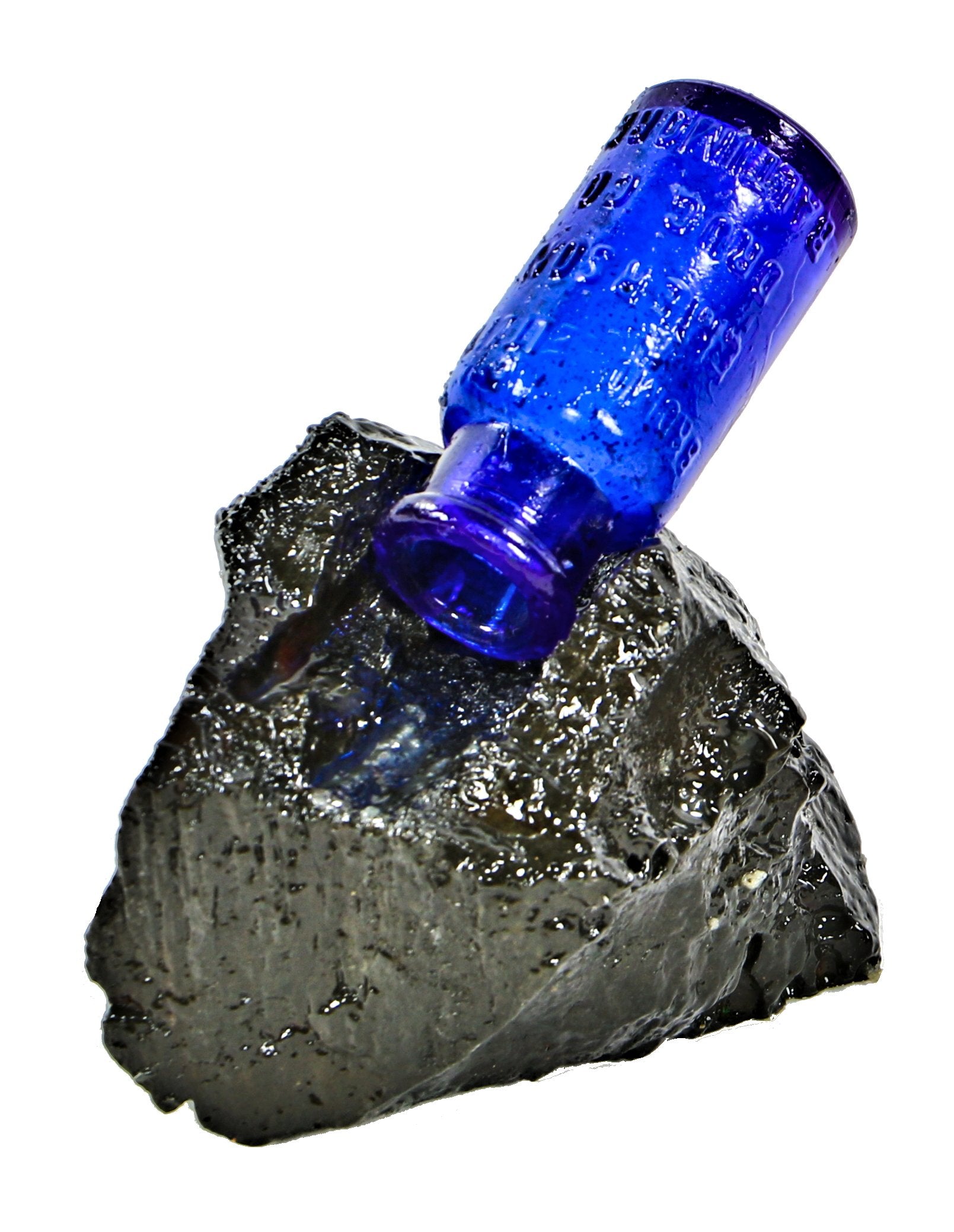 repurposed nineteenth century industrial paperweight comprised of a cobalt 1890's bromo seltzer bottle affixed to a piece of coal