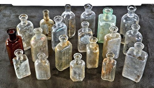assortment of original late 19th and early 20th century privy-dug chicago druggist bottles with bold and deeply embossed markings