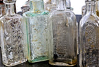 assortment of original late 19th and early 20th century privy-dug chicago druggist bottles with bold and deeply embossed markings