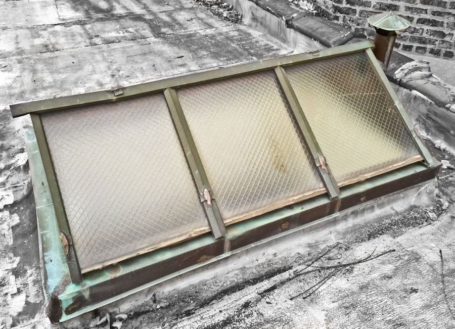 rare and hard to find completely intact c. 1909 exterior residential compact double-pitched metal wire glass rooftop skylight with nicely aged copper flashings and ventilator