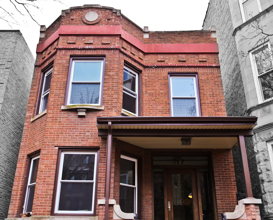 one of two matching original original early 20th century varnished golden oak wood residential pantry swinging door with intact large "florentine" pattern privacy glass pane