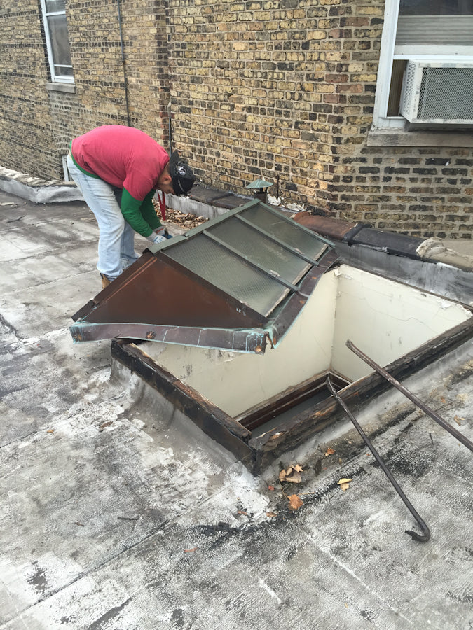 rare and hard to find completely intact c. 1909 exterior residential compact double-pitched metal wire glass rooftop skylight with nicely aged copper flashings and ventilator
