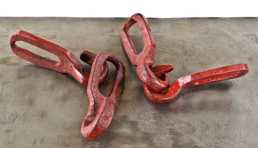 group of four nicely distressed oversized late 19th or early 20th century hand-forged wrought iron red painted interlocking hooks from a factory or farmstead