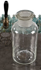 all original and seldom found oversized early 20th century antique american industrial well-maintained and cleaned clear glass "thorium" laboratory bottle with original ground glass stopper