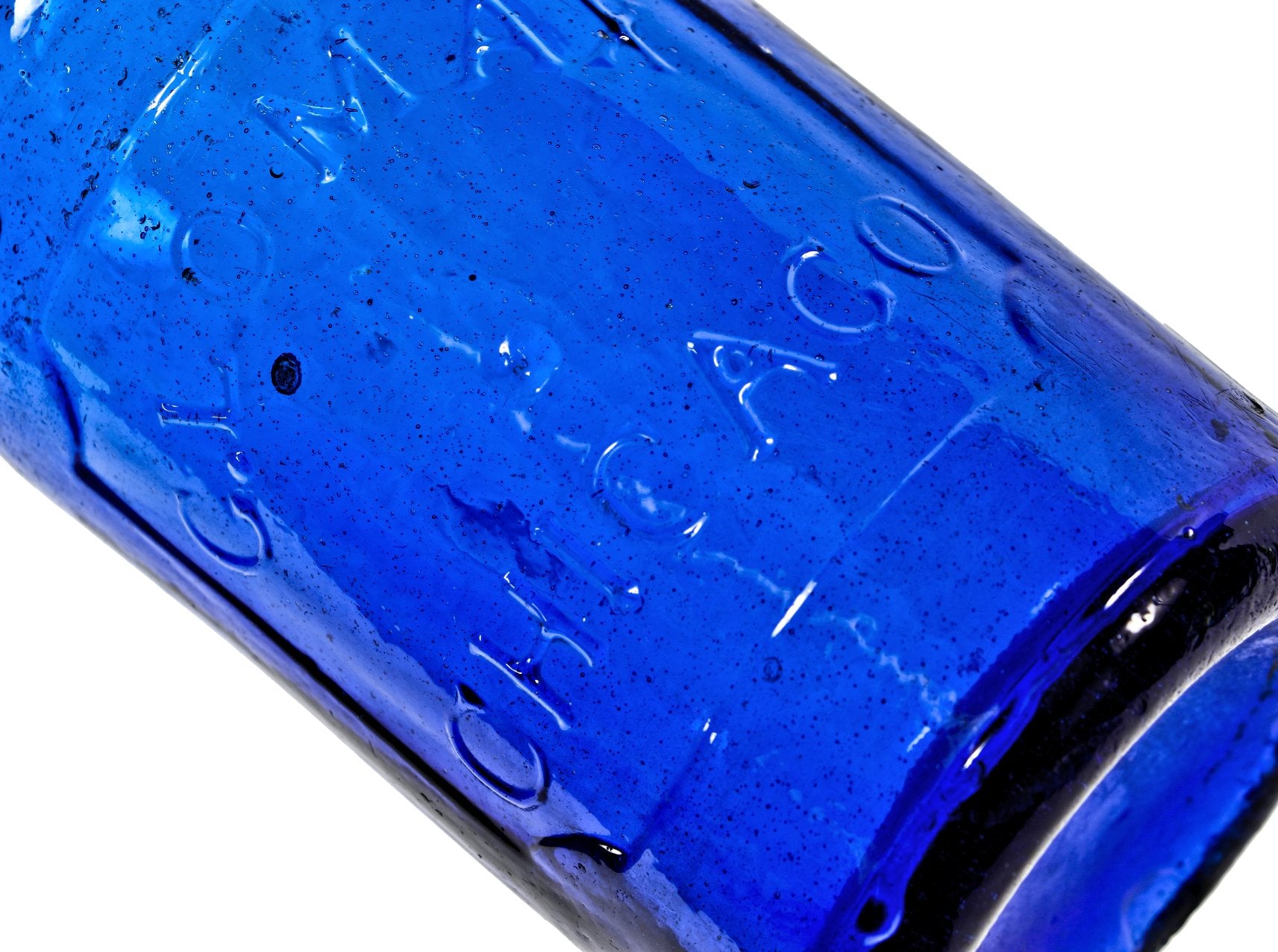 original and intact mid-nineteenth century richly colored electric blue glass pontiled blobtop soda bottle fabricated for george lomax in chicago, il.