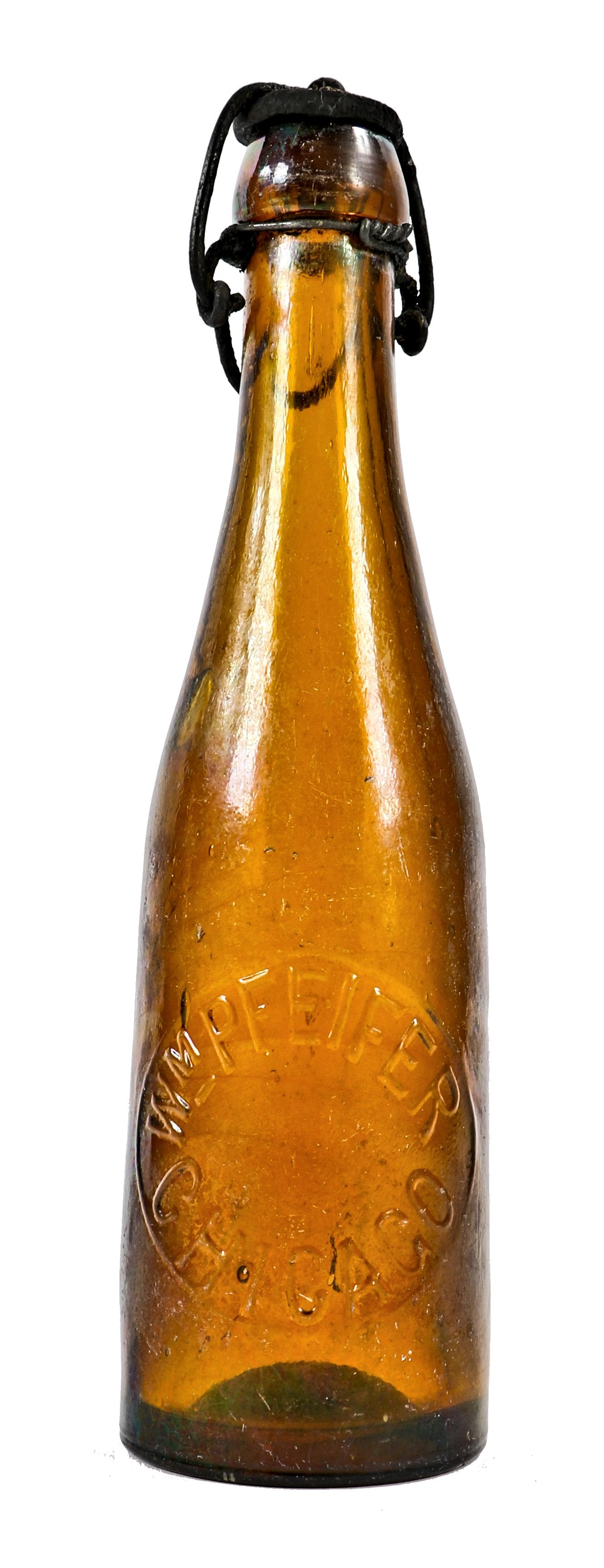 single intact c. 1880's or 1890's american privy dug medium amber weiss beer bottle manufactured for chicago bottler william pfeifer