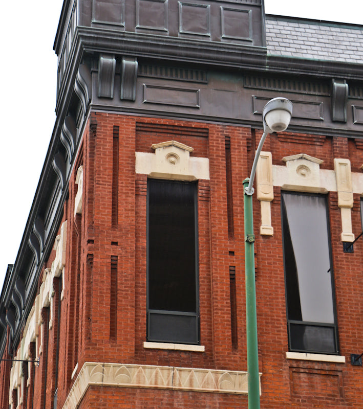 historically important late 1870's or early 1880's american oversized john voltz hall exterior cut "athens" limestone upper floor window hood or header with centrally located bullseye