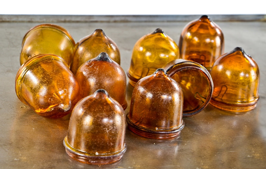 large lot of original and intact dark amber colored mold-blown american antique depression-era "reco" theater marquee sign light bulb hoods with internal steel clamps