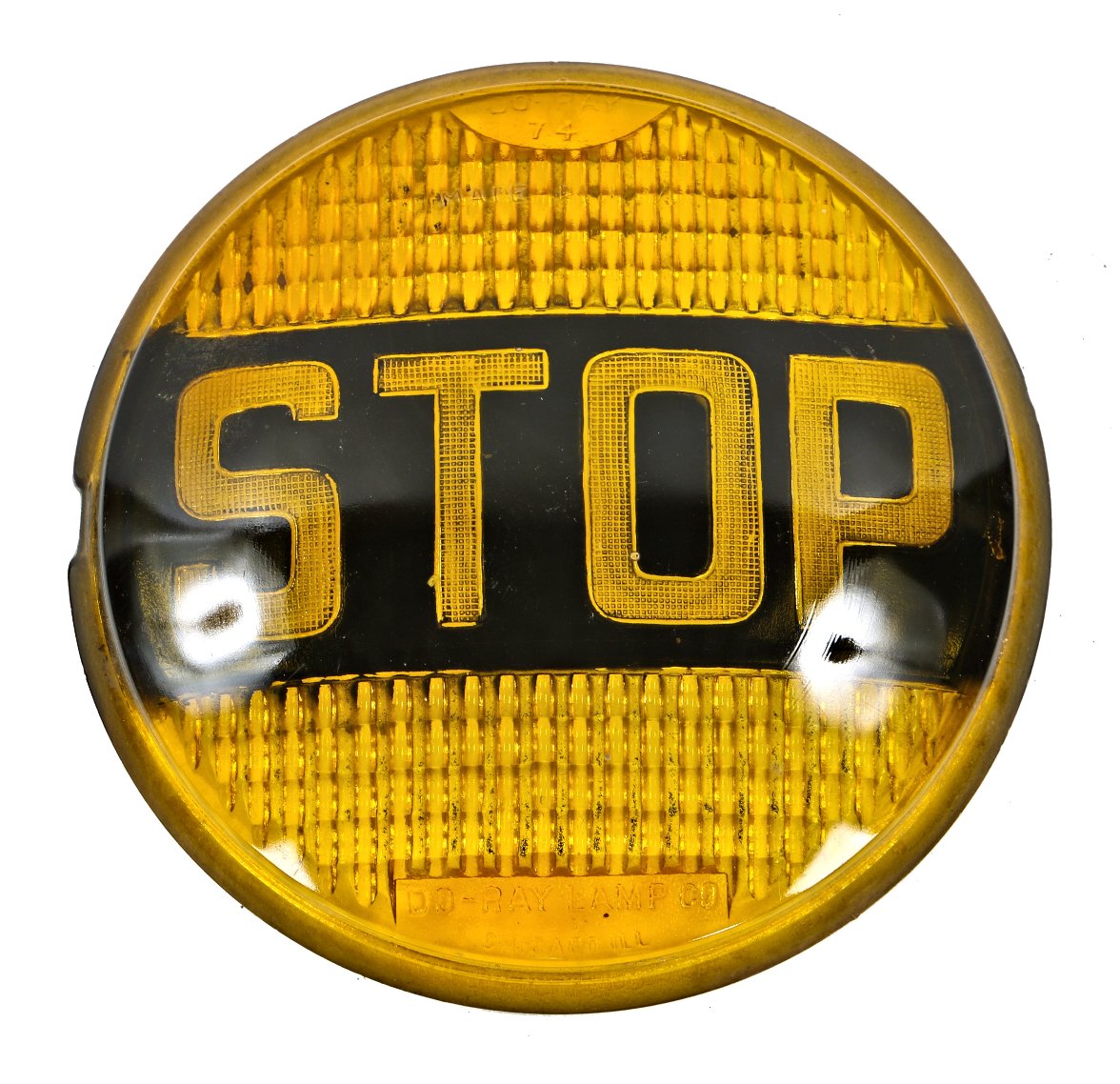 single original and intact vintage c. 1940's automotive pressed yellow glass automotive stop light lens with baled black enamel surrounding incised lettering