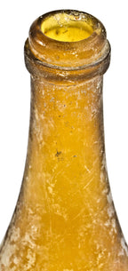 exceptionally rare antique american mid-nineteenth century privy dug vibrant yellow colored champagne style beer bottle with applied ring fabricated for the chicago bottlers the lang brothers.