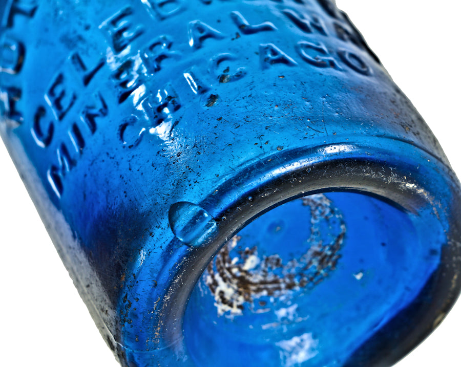 highly collectible antique american mid-nineteenth century deep cobalt blue glass iron pontiled soda bottle with appealing crudity fabricated for chicago bottling giant william h. hutchinson & company.