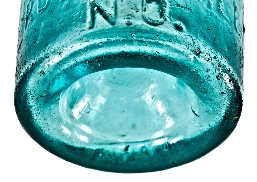 single hard to find and all original crude mid-nineteenth century vibrant greenish aqua pontiled soda bottle manufactured for new orleans bottler miguel piris.