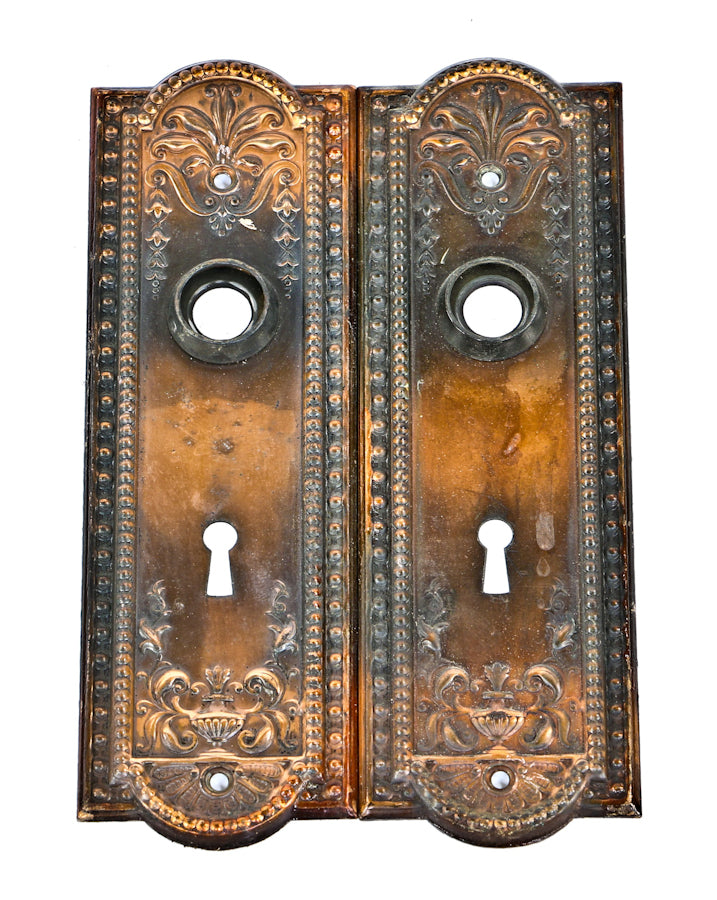 pair of original and intact early 20th century antique american "como" pattern interior residential passage door escutcheons with highly desirable oxidized copper-plated finish