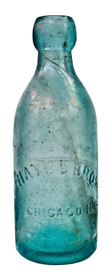 single intact and all original american nineteenth century irridized green aqua glass soda bottle manufactured for chicago bottlers the hayes brothers.
