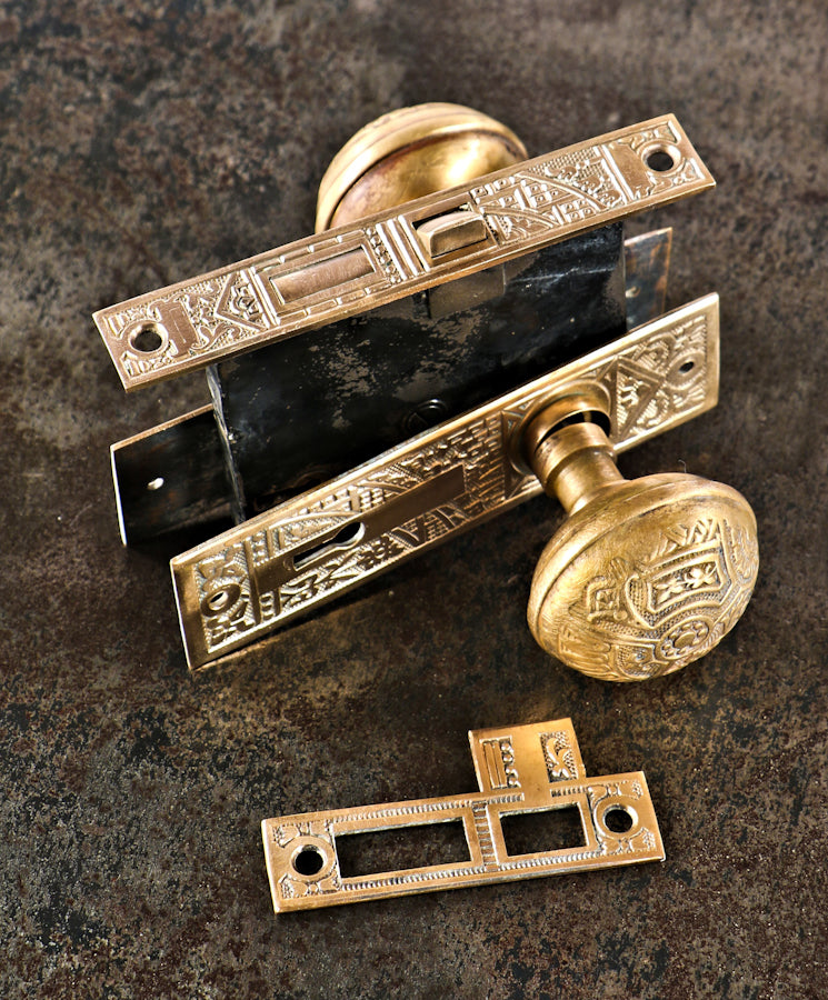 late 19th century antique american ornamental wrought brass eastlake style "ceylon" pattern complete passage door lockset with fully functional mortise lock