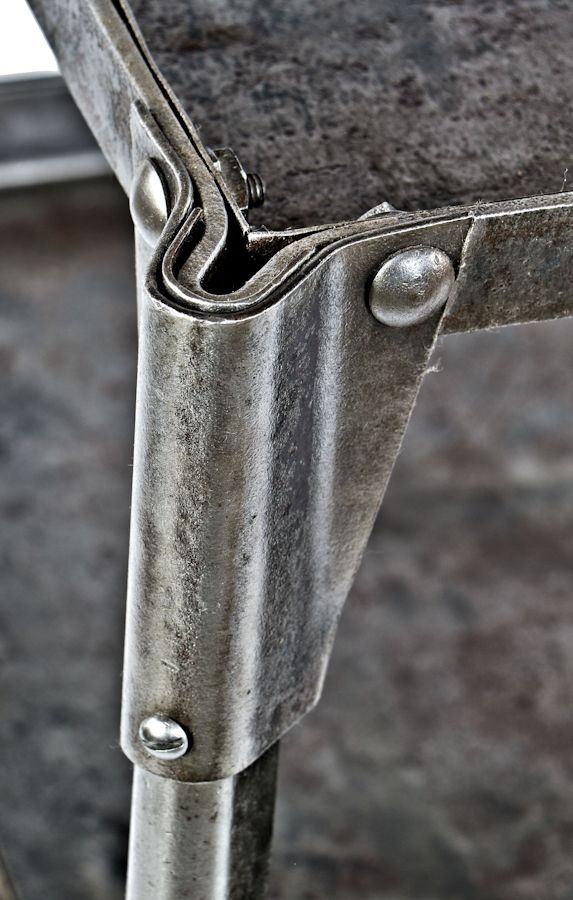 early 1930's antique american industrial freestanding pressed and formed steel stationary "uhl art steel" tool stand with riveted joint reinforced corner guards