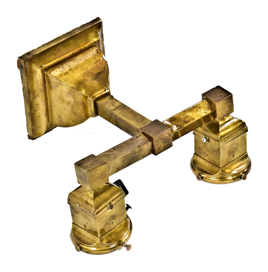 early 20th century antique american arts & crafts or craftsman style interior residential yellow brass double arm wall sconce with distinctive socket covers