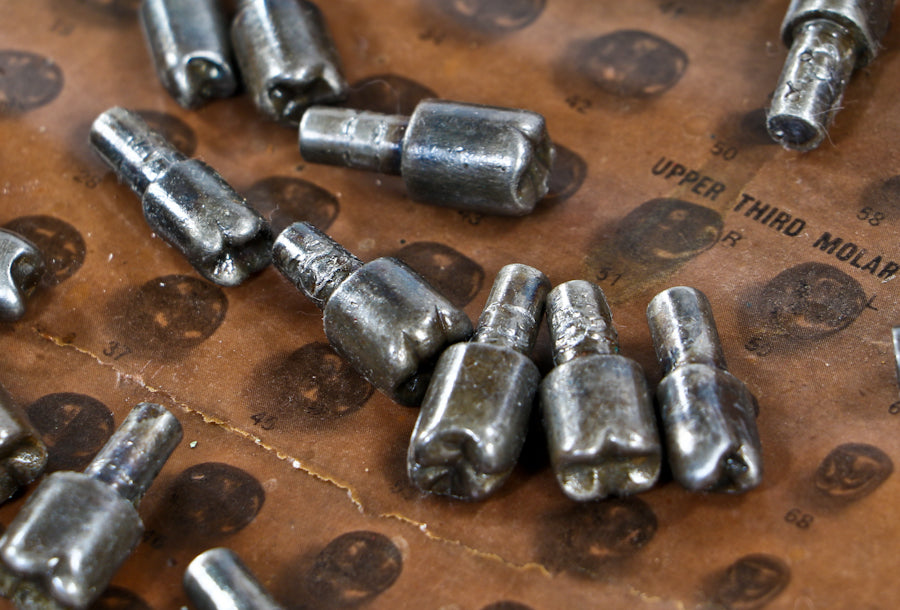 group of early 20th century diminutive antique american medical machined solid steel "s.s. white" human molar tooth forms with integrated shanks