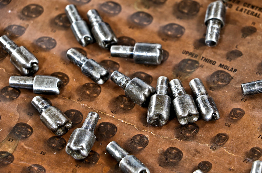 group of early 20th century diminutive antique american medical machined solid steel "s.s. white" human molar tooth forms with integrated shanks